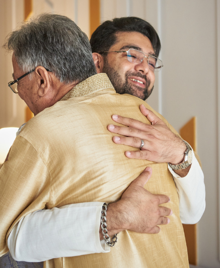 A shot of a son hugging his dad