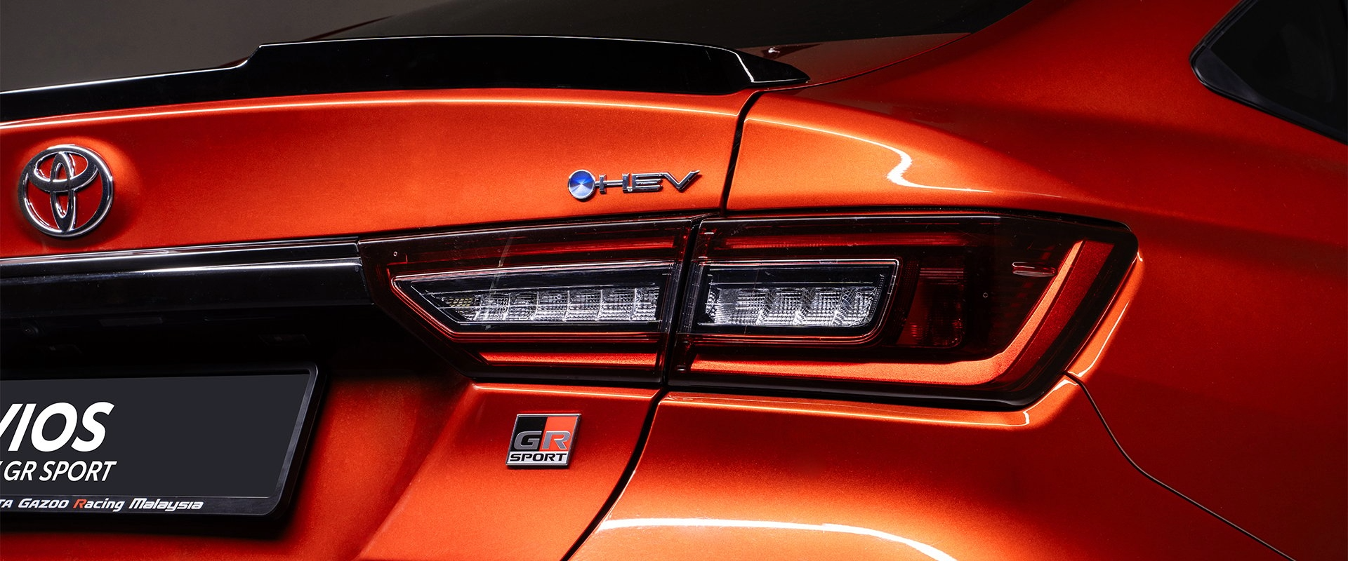 GR badge on the back on a red Toyota Vios HEV GR Sport
