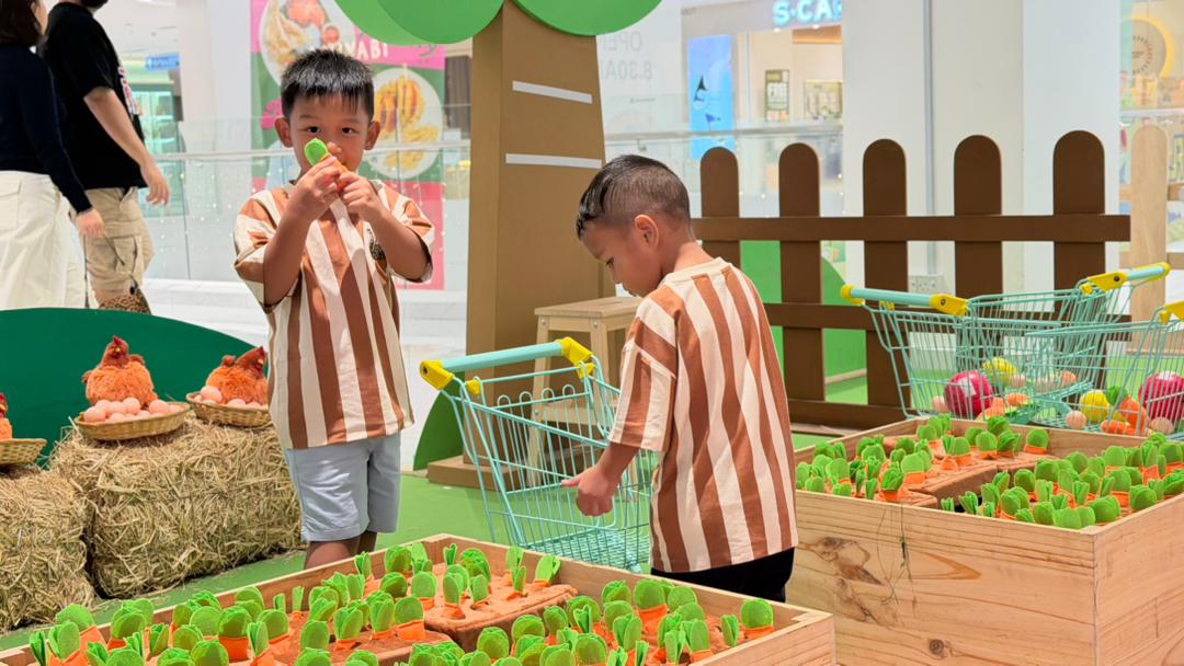 two boys playing carrot harvesting