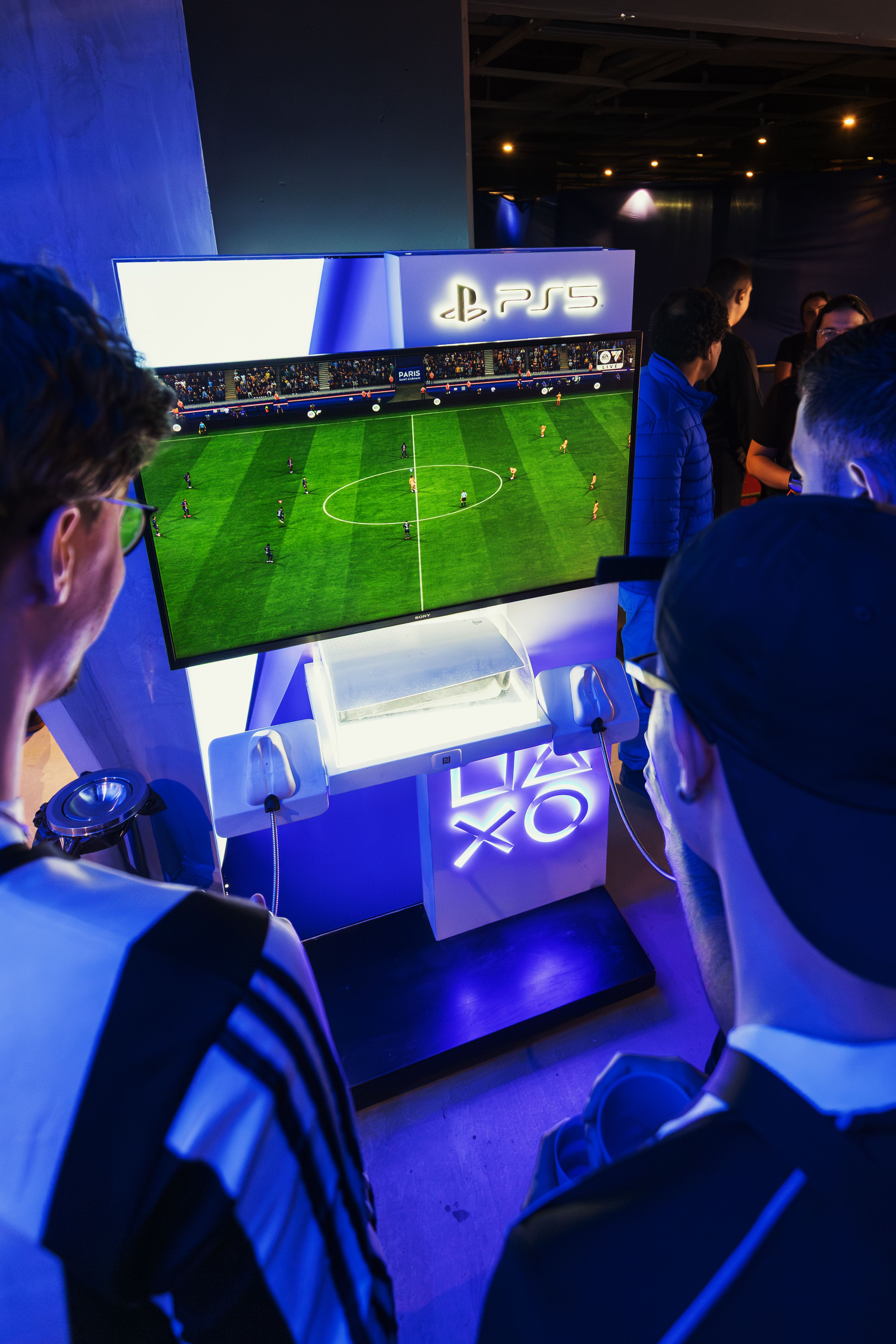 Men playing football game on a PS5